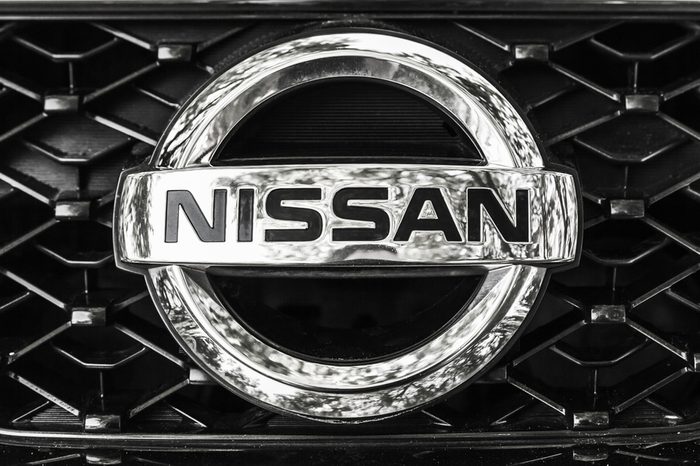 St-Petersburg, Russia - May 15, 2016: Nissan car logo on a front radiator grille of Nissan X-Trail SUV, closeup photo with selective focus