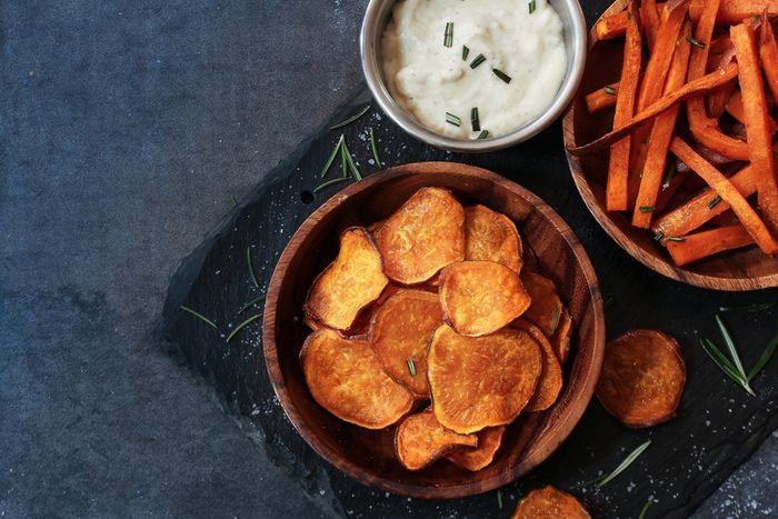 Homemade Sweet potato chips and fries served with dips / Thanksgiving food