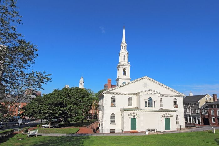 View of the First Baptist Church in America and partial skyline of Providence, Rhode Island, from College Hill against a bright blue sky