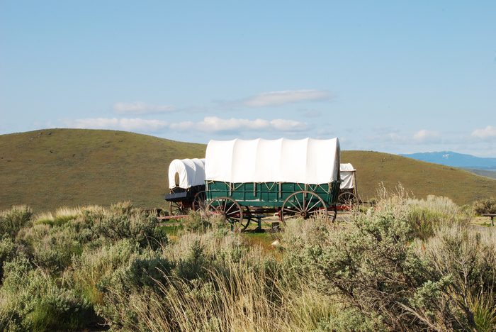 The National Historic Oregon Trail Interpretive Center near Baker City Oregon. Wagons at the Center with the Blue Mountains in the background