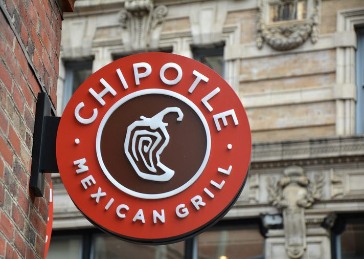 BOSTON, USA - OCTOBER 21, 2014 : Chipotle Mexican Grill signboard on the wall in Boston. Chipotle is a chain of American restaurants serving mexican food