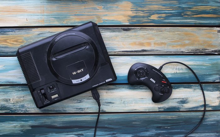 CLEETHORPES, UK - February 28 2017: A studio shot of a Sega Mega Drive game console, a 16-bit video games machine that was popular in the late 80s and early 90s