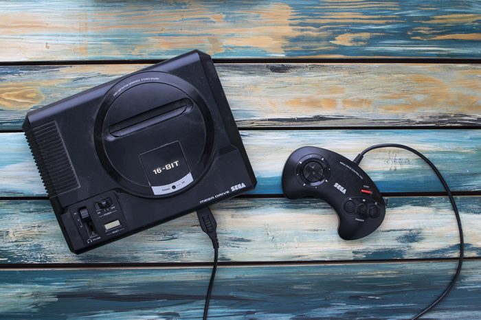 CLEETHORPES, UK - February 28 2017: A studio shot of a Sega Mega Drive game console, a 16-bit video games machine that was popular in the late 80s and early 90s