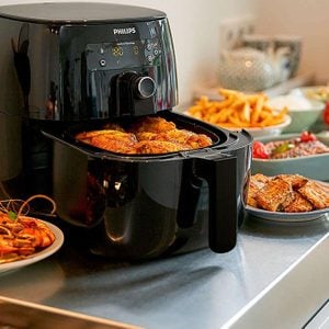black philips air fryer with food inside