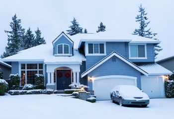 Fresh blanket of snow on residential home during the winter holidays.