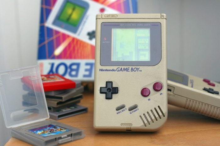 LJUBLJANA, SLOVENIA - DECEMBER 30, 2013: Photo of an original Nintendo handheld video game device Game boy (1989) with Tetris game playing.Showing obvious signs of longtime use.
