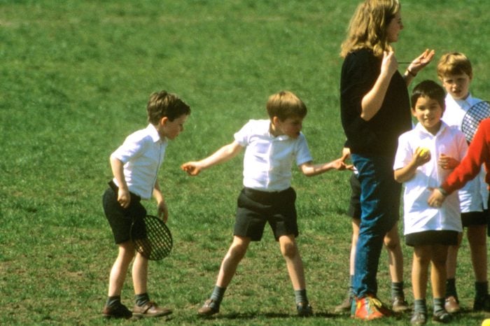 Prince William pinches his teacher's bottom whilst at his school games lesson in Richmond, London, Britain - Apr 1989