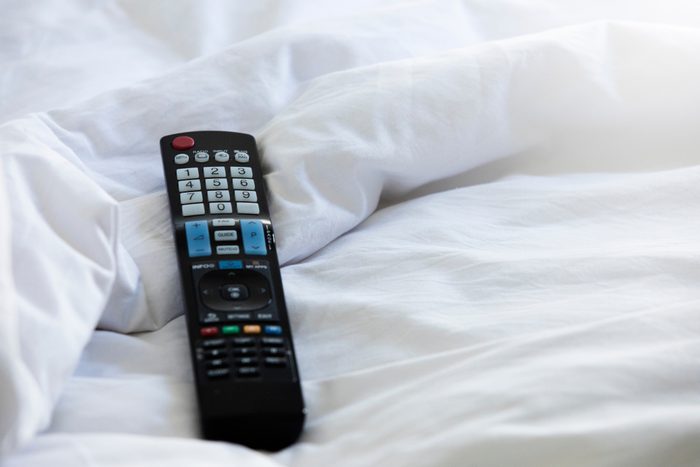 Remote control on a hotel bed