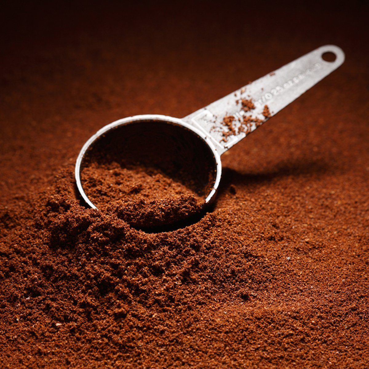 Ground coffee background / coffee scoop