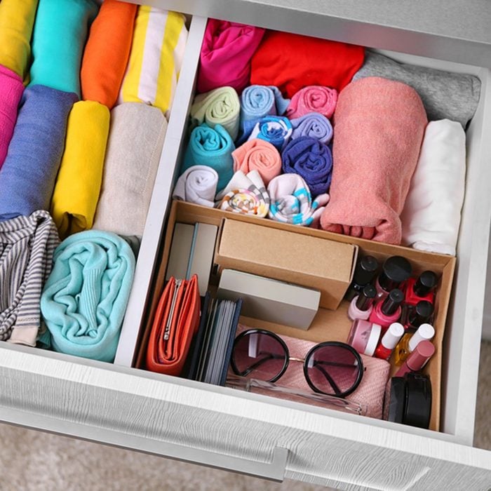 Neatly folded clothes with accessories in chest of drawers; Shutterstock ID 453967519; Job (TFH, TOH, RD, BNB, CWM, CM): Taste of Home