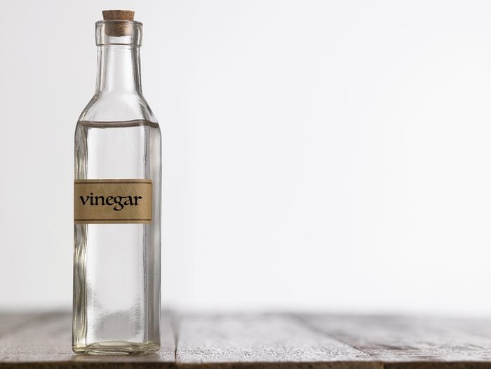 white vinegar on the wooden table top