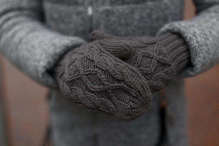 Vintage knitted gray mittens.
