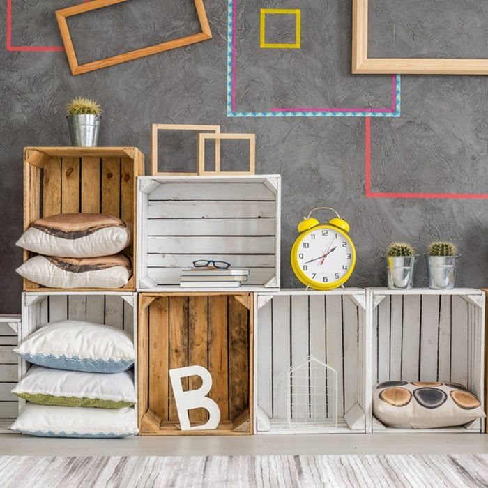 Creative cabinet made of wooden recycled boxes; Shutterstock ID 589573676