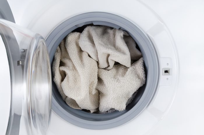 white clothes wash, open washing machine with towel