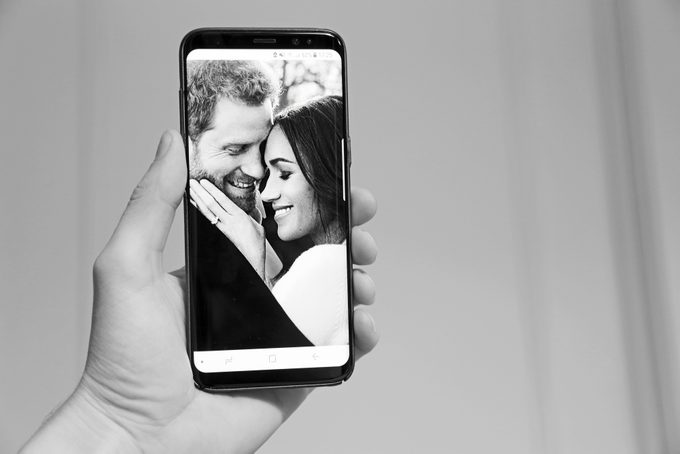 Phone with picture of Prince Harry and Meghan Markle