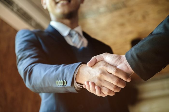 Welcome to board! Asian business people shaking hands with new partner meeting time after agree join new start up project, business co-working teamwork concept