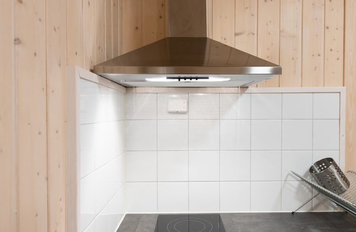 Stainless still hood is in the modern kitchen
