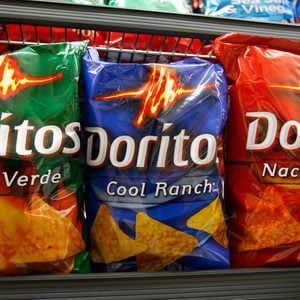 Mandatory Credit: Photo by Paul Sakuma/AP/REX/Shutterstock (6304574g) Doritos chips are shown on display at a grocery store in Palo Alto, Calif., . PepsiCo's third-quarter net income rose 12 percent on strong sales gains abroad and strength in its drinks and Frito-Lay snacks Earns Pepsico, Palo Alto, USA