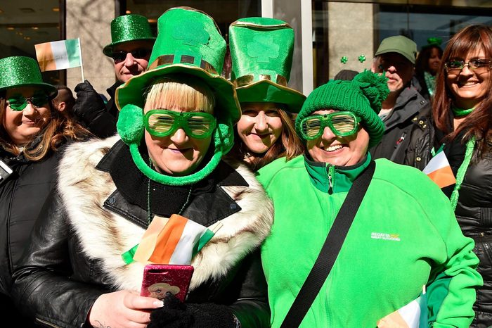 spectators along the route of the new york city st patrick's day parade