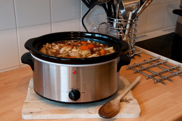 Slow cooker cooking Scouse in a Kitchen with some kitchen items in view