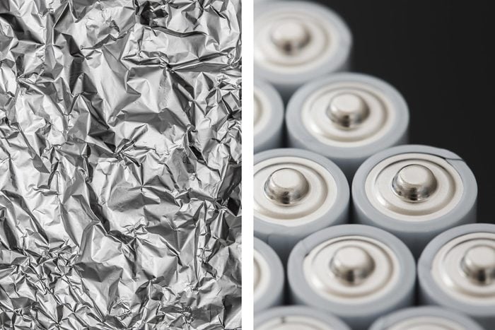 Aluminum foil texture next to dozens of batteries