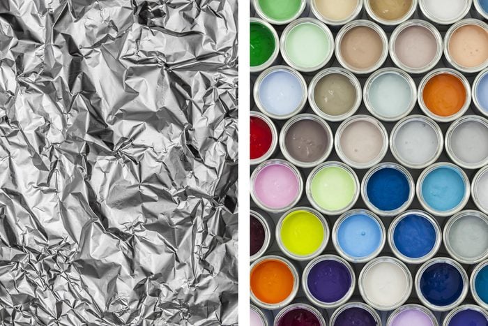 Aluminum foil texture next to different colors of paint cans
