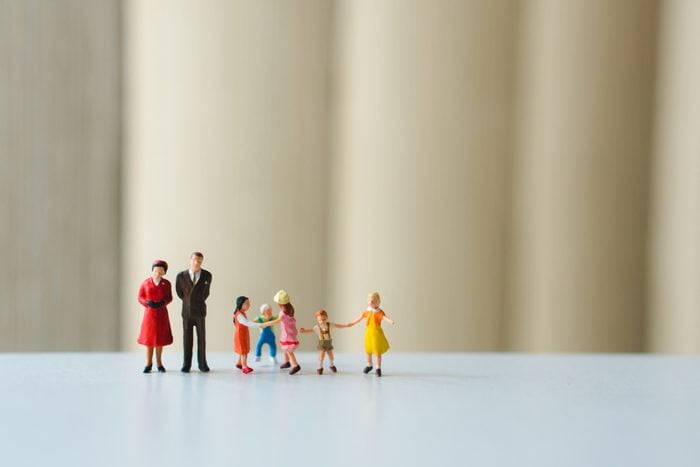 Miniature people, happy family playing together using as family concept