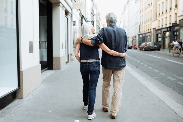 Couple walking down the streets of Paris