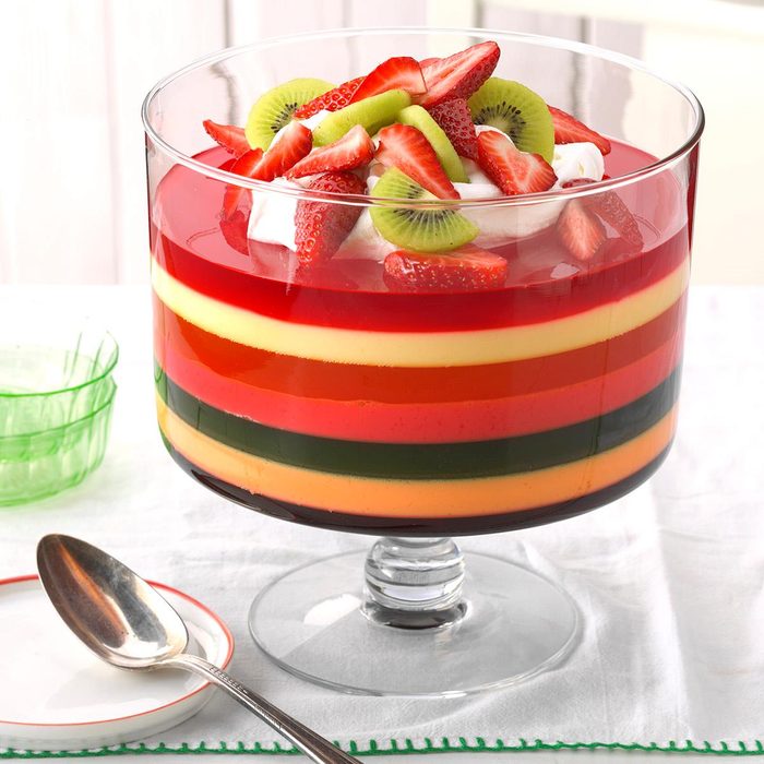 A glass trifle bowl with 7-Layer Gelatin Salad