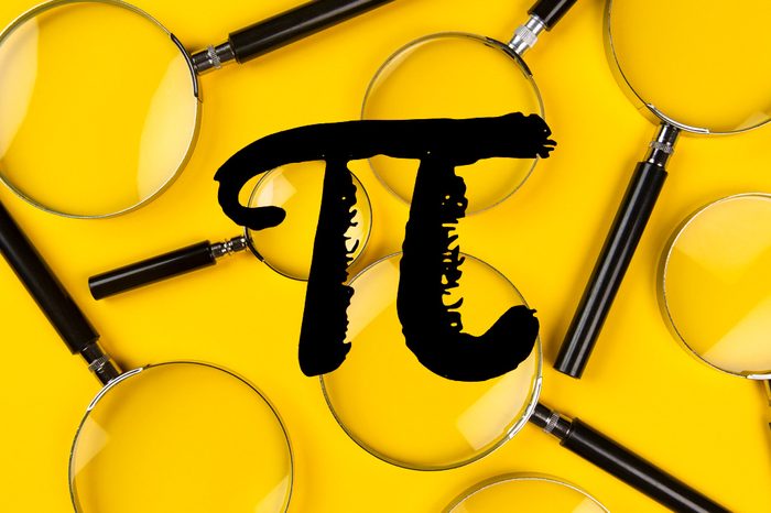 pi symbol over magnifying glasses on yellow background
