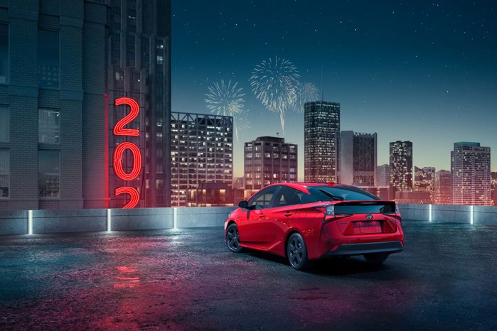 2021 toyota prius on a rooftop ringing in the new year with fireworks