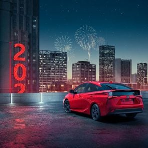 2021 toyota prius on a rooftop ringing in the new year with fireworks