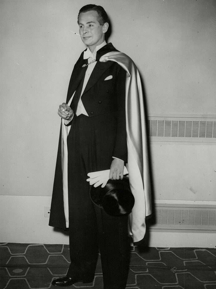 Actor Derek Bond Wearing An Opera Cloak And Full Evening Dress At A Men's Fashion Show At The Royal Festival Hall. Box 720 305121625 A.jpg.