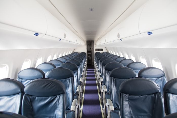 Dark Blue Seats in a Empty Jet Airplane
