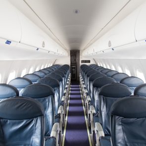 Dark Blue Seats in a Empty Jet Airplane
