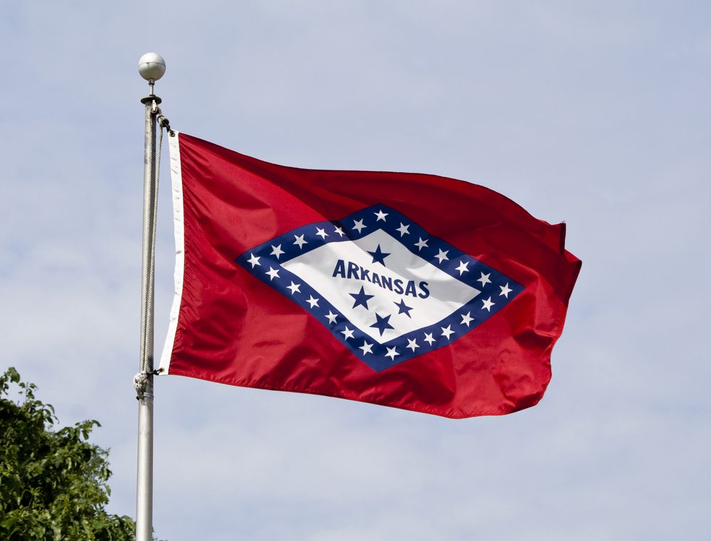 The Arkansas State Flag flying in the wind