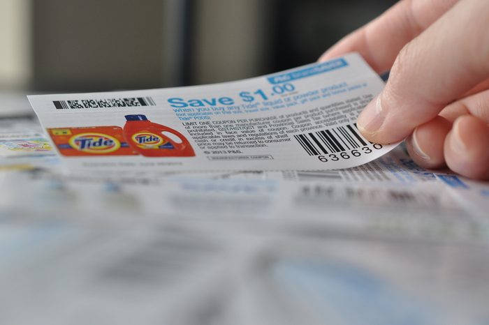 COQUITLAM, BC, CANADA - MAY 8 - Coquitlam BC Canada - May 8, 2014 : Holding coupon for saving item. All coupons for Canadian store, they are issued by manufacturers of consumer packaged goods Canada.