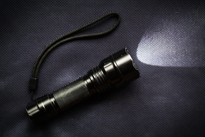 LED flashlight with a light beam for hiking at night
