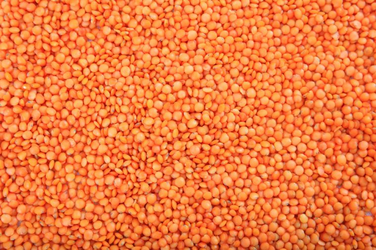 Legumes, pulses. Orange lentils full background, top view 
