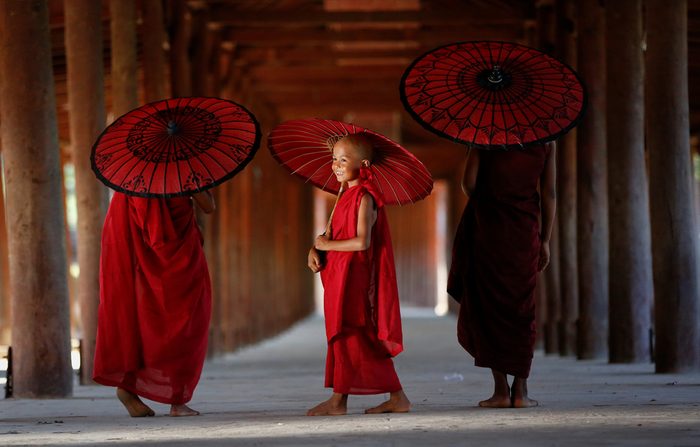 MONK MYANMAR, Southeast Asian young three little monk walkink morning alms in bagan, Buddhist in pagoda myanmar background, 