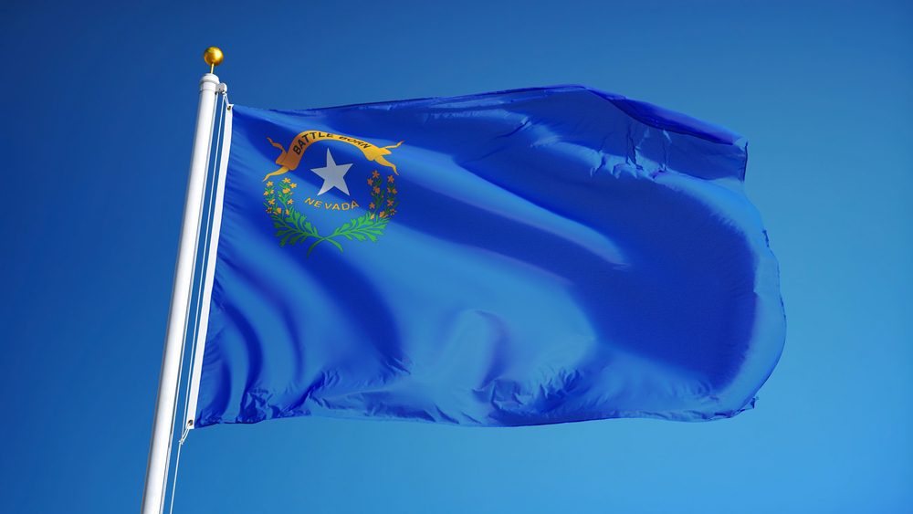 Nevada (U.S. state) flag waving against clear blue sky, close up, isolated with clipping path mask alpha channel transparency, perfect for film, news, composition