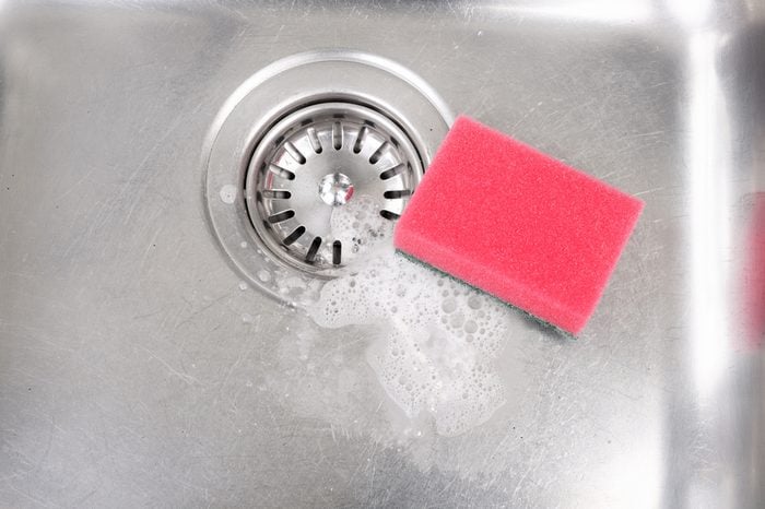 Stainless steel kitchen sink with drain strainer and red sponge