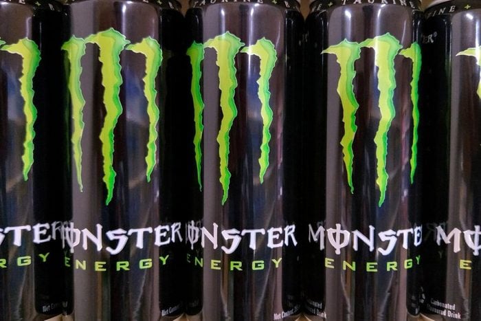 monster energy drinks on a store shelf at a gas station or grocery store