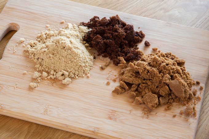 Different types of sugar - dark brown soft, light brown soft &amp; molasses - natural unrefined cane sugar.