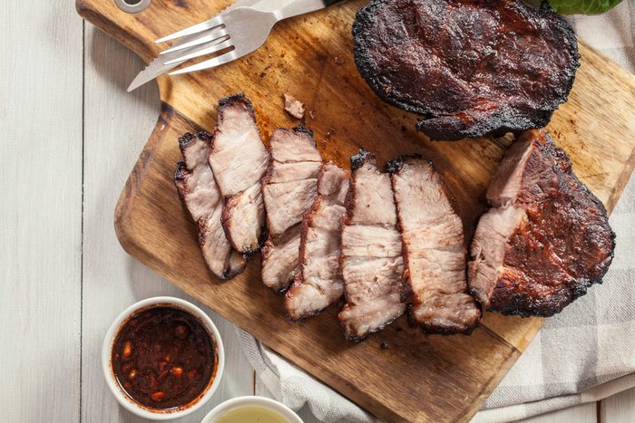 Char Siu Pork - Chinese roasted pork shoulder or pork belly on cutting board