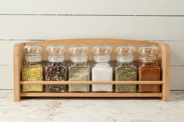 Spices on wooden shelf