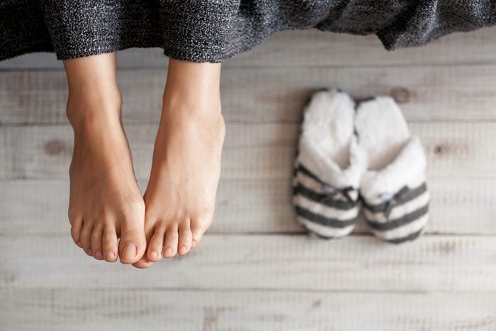 Soft photo of woman feet with slippers, top view point