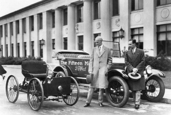 VARIOUS Detroit, Michigan: 1927 Henry Ford (left) and Edsel Ford with the original 1896 Quadricycle and the 15th millionth Ford Model T.