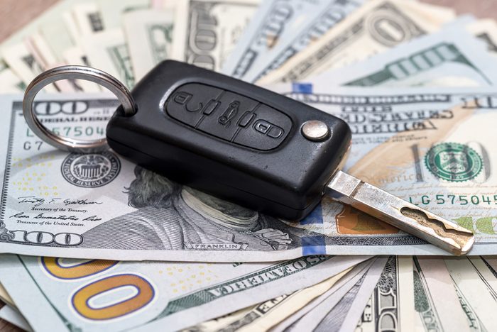car key on dollar bills