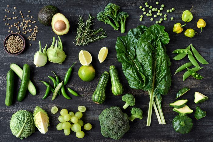 Flat lay series of assorted green toned vegetables, fresh organic raw produce